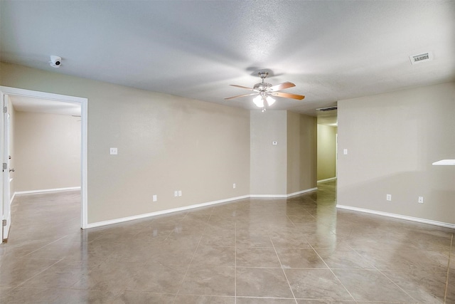 1414 Cheyenne Trl, Granbury, TX 76048 - spare room featuring a ceiling fan and light tile patterned flooring