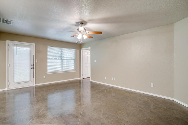 1414 Cheyenne Trl, Granbury, TX 76048 - tiled empty room featuring ceiling fan and a textured ceiling