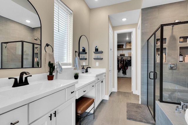1415 Misty Pasture Way, Mansfield, TX 76063 - bathroom featuring a stall shower, double vanity, a walk in closet, recessed lighting, and a tub