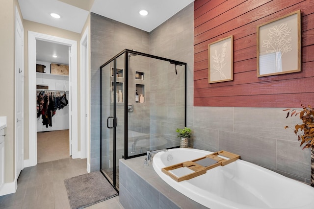 1415 Misty Pasture Way, Mansfield, TX 76063 - full bathroom featuring a walk in closet, a shower stall, a garden tub, and recessed lighting