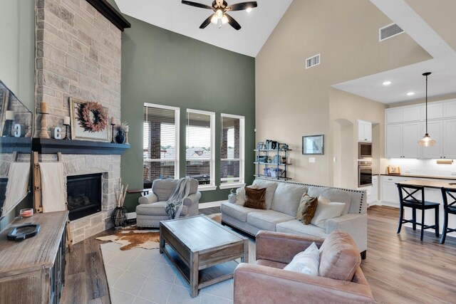 1415 Misty Pasture Way, Mansfield, TX 76063 - living area featuring high vaulted ceiling, a ceiling fan, a fireplace, light wood-type flooring, and recessed lighting