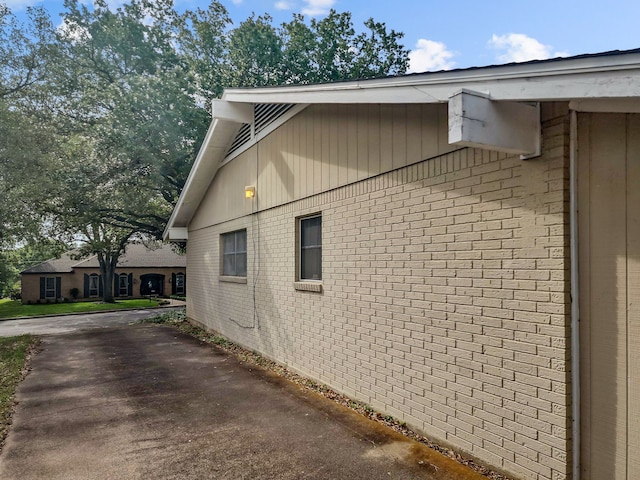 2641 Woodmont Cir, Waco, TX 76710 - view of side of home with brick siding