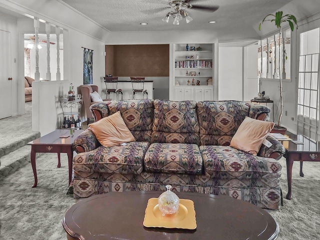 2641 Woodmont Cir, Waco, TX 76710 - carpeted living area with ceiling fan, a textured ceiling, plenty of natural light, and built in features