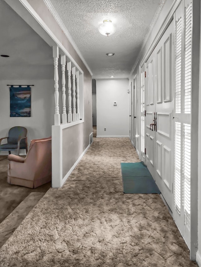 2641 Woodmont Cir, Waco, TX 76710 - corridor featuring carpet floors, a textured ceiling, and crown molding