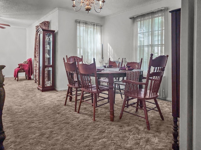 2641 Woodmont Cir, Waco, TX 76710 - dining space with plenty of natural light, carpet flooring, a chandelier, crown molding, and a textured ceiling