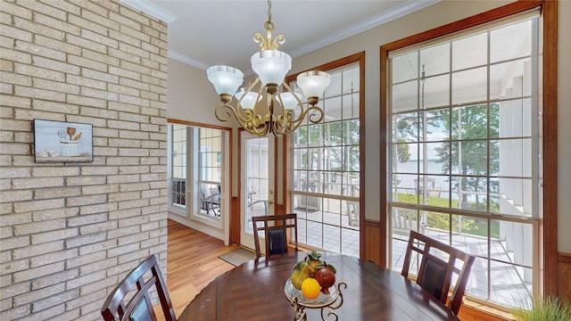 22770 Diamond Bay Dr, Frankston, TX 75763 - dining room featuring a chandelier, ornamental molding, plenty of natural light, and wood finished floors