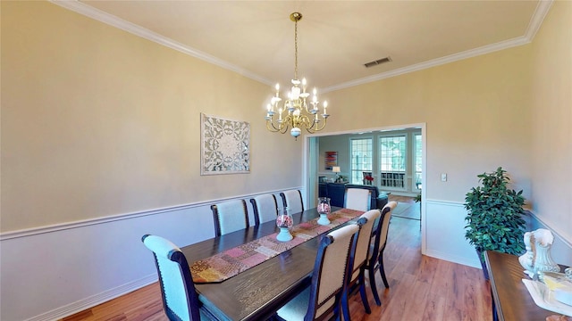 22770 Diamond Bay Dr, Frankston, TX 75763 - dining room featuring a chandelier, crown molding, and wood finished floors