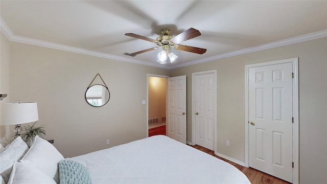 22770 Diamond Bay Dr, Frankston, TX 75763 - bedroom with ornamental molding, wood finished floors, and a ceiling fan