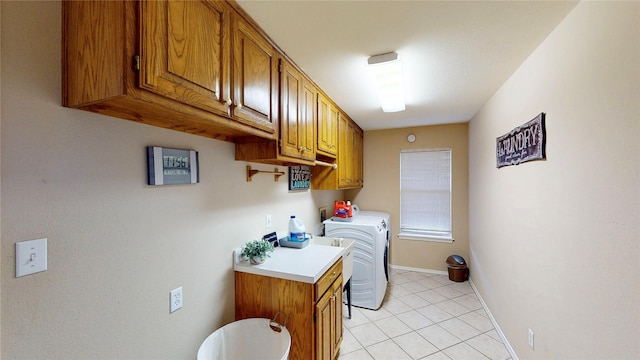 22770 Diamond Bay Dr, Frankston, TX 75763 - laundry area featuring light tile patterned flooring, independent washer and dryer, and cabinet space