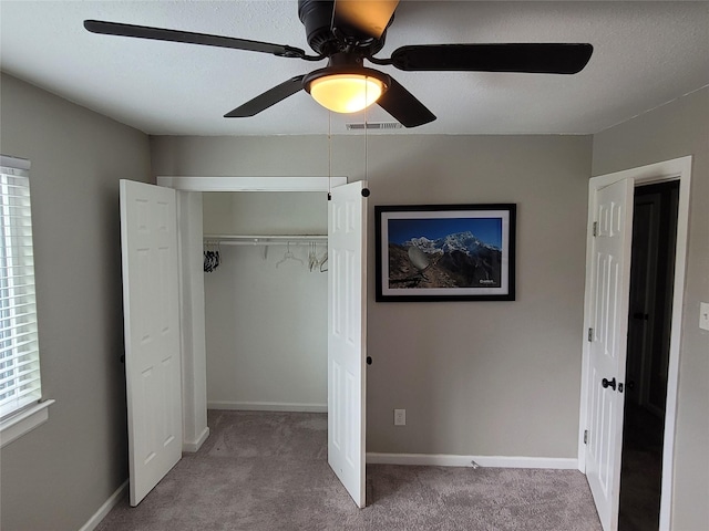 3309 Graybar Dr, Garland, TX 75040 - unfurnished bedroom featuring carpet flooring, a closet, and a ceiling fan