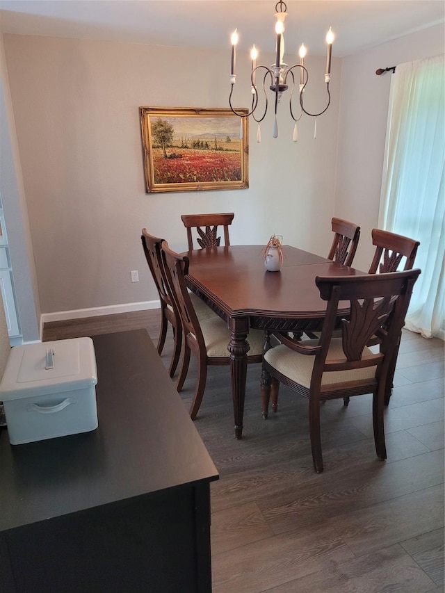 3309 Graybar Dr, Garland, TX 75040 - dining space featuring dark wood-style flooring and a chandelier