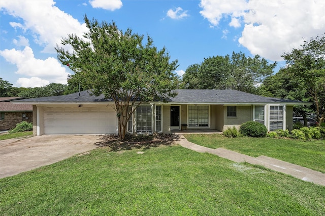431 Brookwood Dr, Woodway, TX 76712 - ranch-style home with brick siding, an attached garage, driveway, and a front lawn