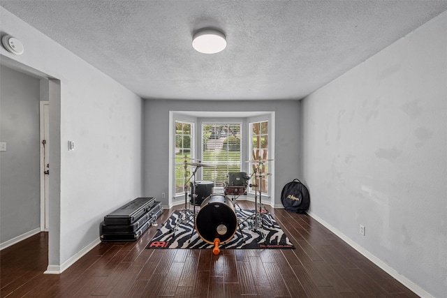 431 Brookwood Dr, Woodway, TX 76712 - living area featuring a textured ceiling, wood finished floors, and an office area