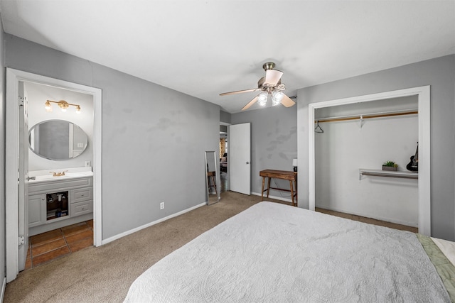 431 Brookwood Dr, Woodway, TX 76712 - carpeted bedroom featuring a closet, ensuite bath, and ceiling fan