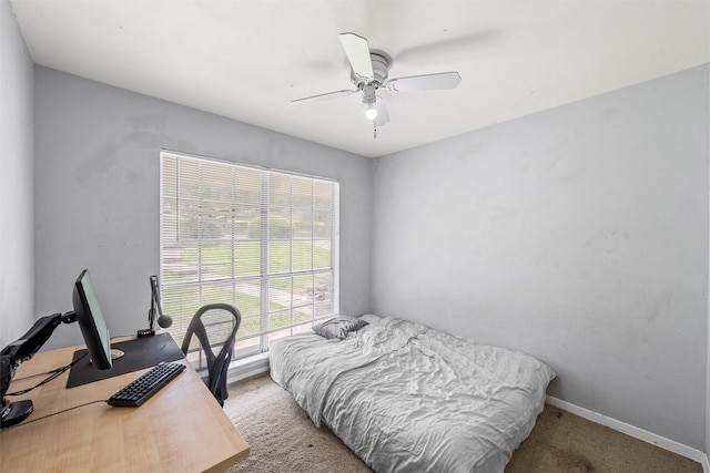 431 Brookwood Dr, Woodway, TX 76712 - carpeted bedroom with a desk and ceiling fan