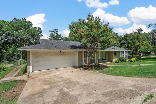 431 Brookwood Dr, Woodway, TX 76712 - view of front of house with brick siding, driveway, and an attached garage
