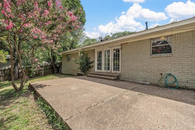 431 Brookwood Dr, Woodway, TX 76712 - rear view of house with french doors, brick siding, and a patio area