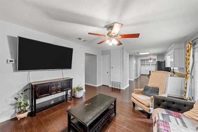 431 Brookwood Dr, Woodway, TX 76712 - living room with ceiling fan and dark wood-style flooring