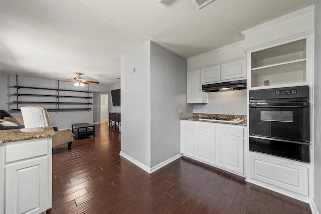 431 Brookwood Dr, Woodway, TX 76712 - kitchen with oven, a warming drawer, under cabinet range hood, ceiling fan, and stone counters