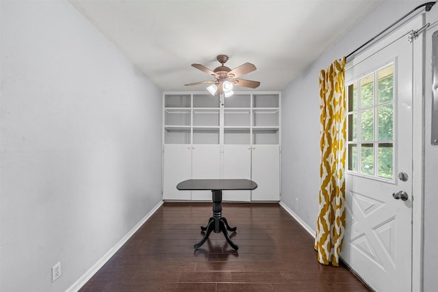 431 Brookwood Dr, Woodway, TX 76712 - workout room with a ceiling fan, dark wood finished floors, and built in shelves