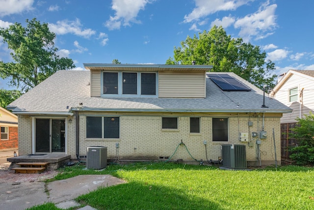 507 Vernet St, Richardson, TX 75080 - rear view of house with roof mounted solar panels and brick siding