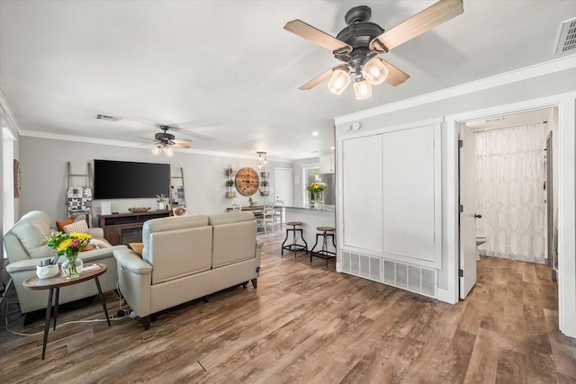3121 SE County Road 2135, Corsicana, TX 75109 - living area featuring ceiling fan, crown molding, and wood finished floors
