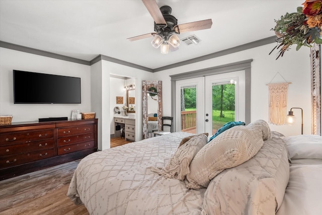 3121 SE County Road 2135, Corsicana, TX 75109 - bedroom with french doors, access to exterior, wood finished floors, ornamental molding, and connected bathroom
