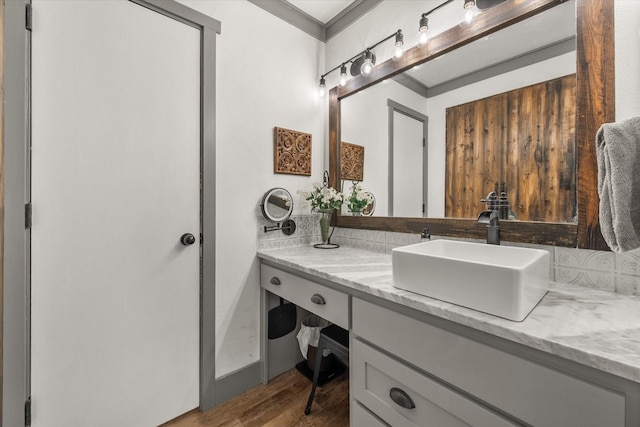 3121 SE County Road 2135, Corsicana, TX 75109 - bathroom with crown molding, vanity, and wood finished floors