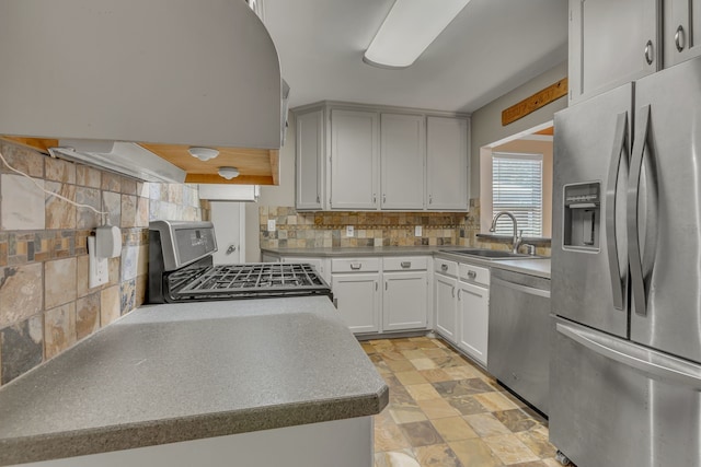 11502 Rupley Ln, Dallas, TX 75218 - kitchen featuring stainless steel appliances, decorative backsplash, exhaust hood, and light stone finish flooring