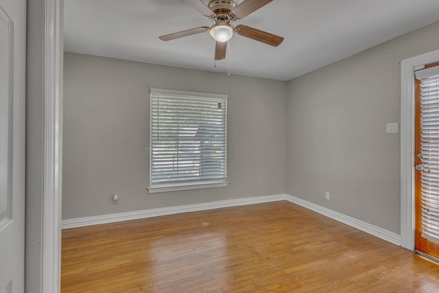 11502 Rupley Ln, Dallas, TX 75218 - spare room featuring light wood-type flooring, ceiling fan, and plenty of natural light