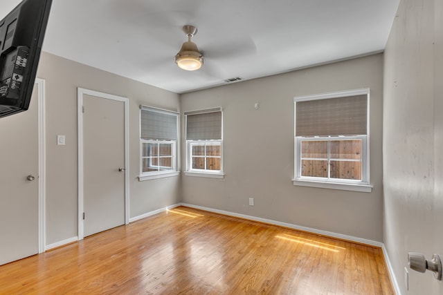 11502 Rupley Ln, Dallas, TX 75218 - empty room featuring wood finished floors and baseboards
