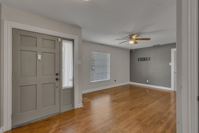 11502 Rupley Ln, Dallas, TX 75218 - foyer entrance with a ceiling fan and wood finished floors