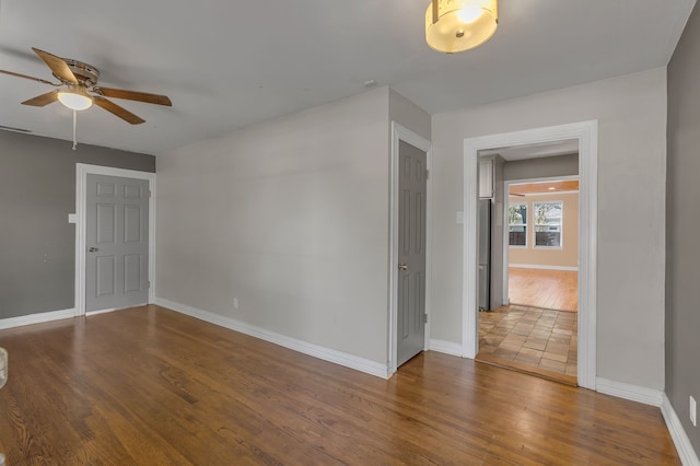 11502 Rupley Ln, Dallas, TX 75218 - empty room featuring a ceiling fan and wood finished floors