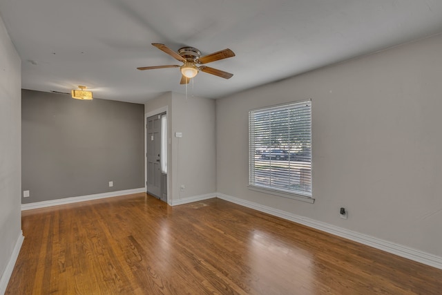 11502 Rupley Ln, Dallas, TX 75218 - empty room with a ceiling fan and wood finished floors