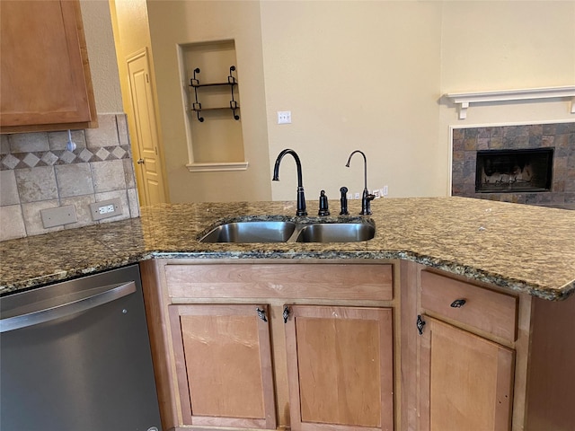 2769 Sunlight Dr, Little Elm, TX 75068 - kitchen with dishwasher, decorative backsplash, dark stone counters, and light brown cabinets