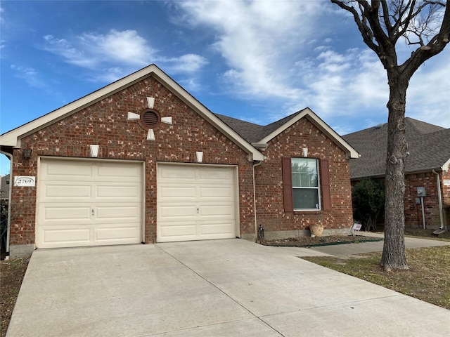 2769 Sunlight Dr, Little Elm, TX 75068 - view of front facade with concrete driveway, brick siding, an attached garage, and roof with shingles
