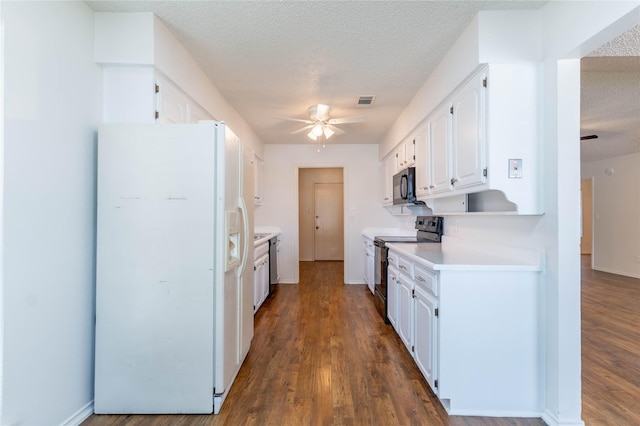 1638 Brown Trl, Hurst, TX 76054 - kitchen featuring white refrigerator with ice dispenser, electric range oven, a ceiling fan, black microwave, and white cabinets