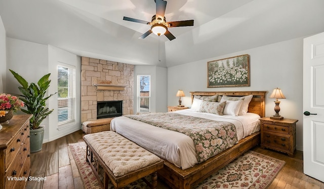 914 Randall Rd, Weatherford, TX 76087 - bedroom featuring hardwood / wood-style floors, a fireplace, a ceiling fan, vaulted ceiling, and access to outside