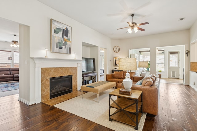 6044 Larkspur Ln, Frisco, TX 75036 - living area featuring ceiling fan, dark wood finished floors, and a tiled fireplace