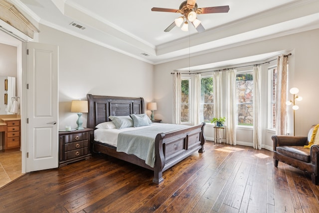 6044 Larkspur Ln, Frisco, TX 75036 - bedroom featuring dark wood-style flooring, a raised ceiling, ornamental molding, and ceiling fan