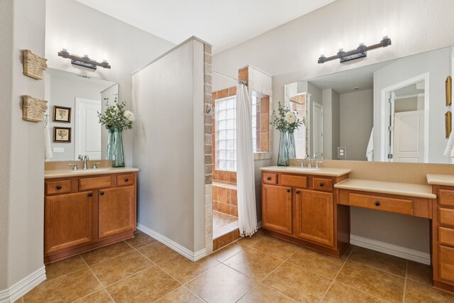 6044 Larkspur Ln, Frisco, TX 75036 - full bathroom with walk in shower, tile patterned flooring, and two vanities