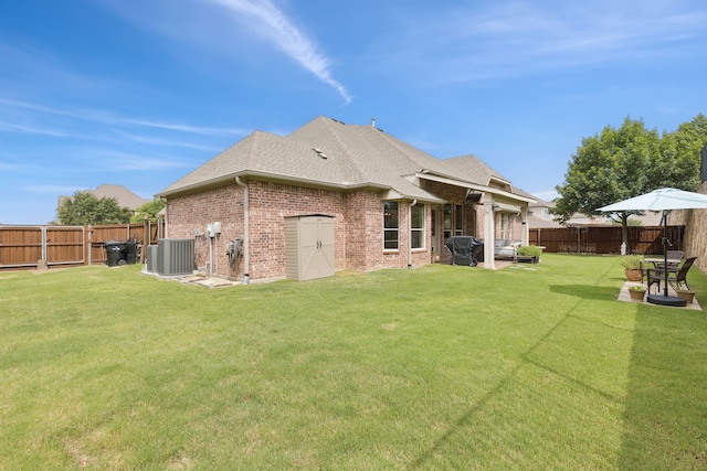 6044 Larkspur Ln, Frisco, TX 75036 - rear view of property with a fenced backyard, a patio, brick siding, a shingled roof, and an outdoor living space