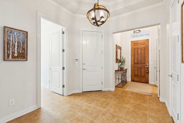 6044 Larkspur Ln, Frisco, TX 75036 - entryway with a chandelier, crown molding, and light tile patterned flooring