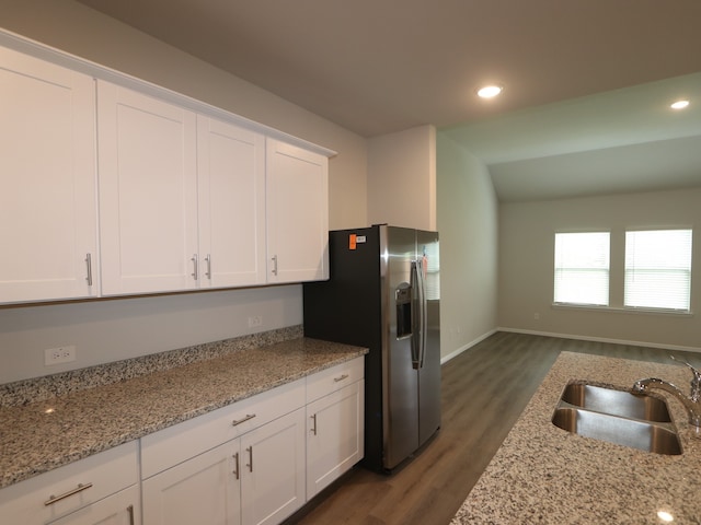 453 Forsyth Dr, Princeton, TX 75407 - kitchen featuring stainless steel fridge with ice dispenser, wood finished floors, white cabinetry, recessed lighting, and light stone countertops