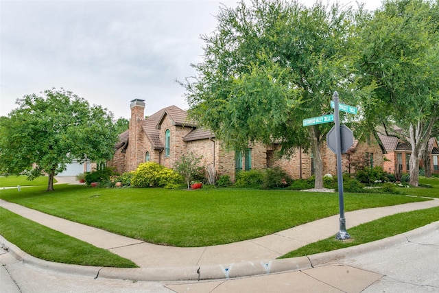 1600 Crockett Cir, Irving, TX 75038 - view of front of property featuring a front yard, a chimney, and stone siding