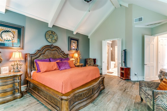 1600 Crockett Cir, Irving, TX 75038 - bedroom with wood finished floors, beam ceiling, ensuite bathroom, high vaulted ceiling, and ceiling fan