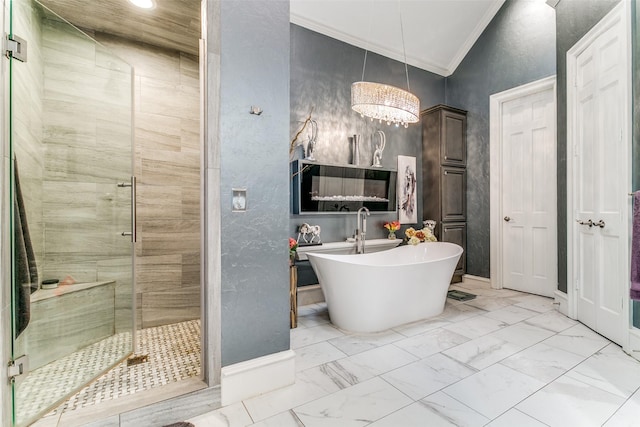 1600 Crockett Cir, Irving, TX 75038 - bathroom with a stall shower, crown molding, a soaking tub, a textured wall, and marble look tiles