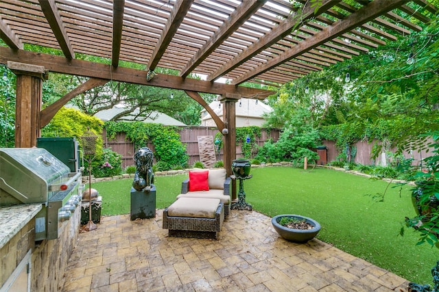 1600 Crockett Cir, Irving, TX 75038 - fenced backyard with a patio area, a pergola, and an outdoor kitchen