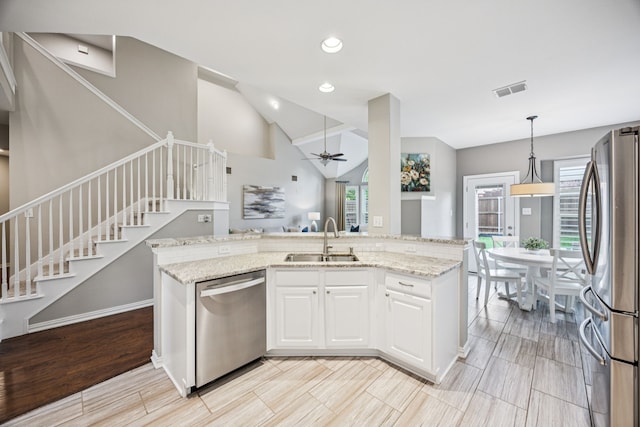 3805 Blaylock Pl, Plano, TX 75025 - kitchen featuring stainless steel appliances, ceiling fan, plenty of natural light, light stone countertops, and recessed lighting