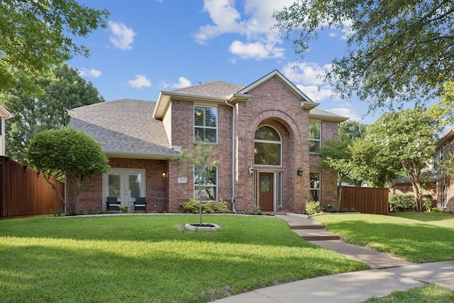 3805 Blaylock Pl, Plano, TX 75025 - traditional-style home with brick siding, roof with shingles, and french doors